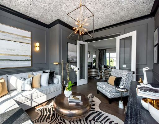 Gray Paneled Walls with Black Trim.